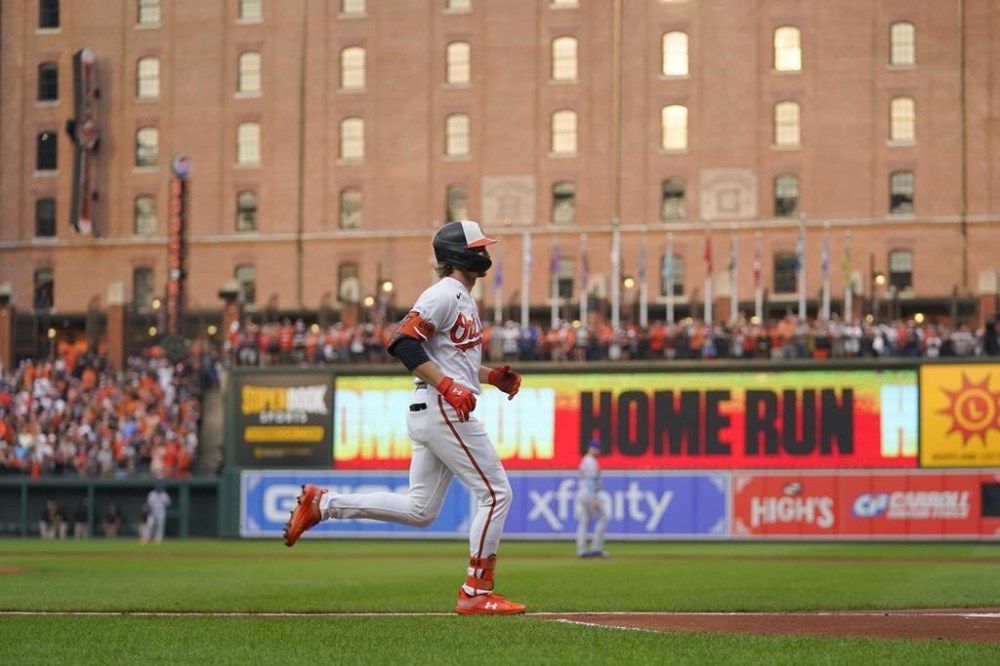 Baltimore Orioles' Gunnar Henderson runs the bases after hitting a two-run home run off New York Mets starting pitcher Tylor Megill in the first inning of a baseball game, Saturday, Aug. 5, 2023, in Baltimore. Orioles' Adley Rutschman scored on the home run. (AP Photo/Julio Cortez)