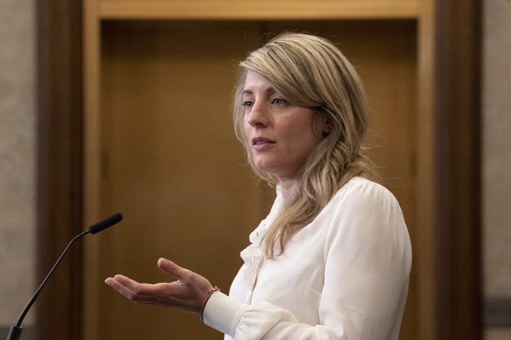 Foreign Affairs Minister Mélanie Joly responds to a question during a news conference in the foyer of the House of Commons, in Ottawa, Tuesday, May 9, 2023. Ottawa has announced it will stop providing financial assistance to Niger's government in the wake of a military coup in the West African country. THE CANADIAN PRESS/Adrian Wyld