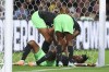 Nigeria's Osinachi Ohale, bottom, is checked on by her teammates after scoring and being kicked in the chest during the Women's World Cup Group B soccer match between Australia and Nigeria in Brisbane, Australia, Thursday, July 27, 2023. Nigeria won 3-2. (AP Photo/Katie Tucker)