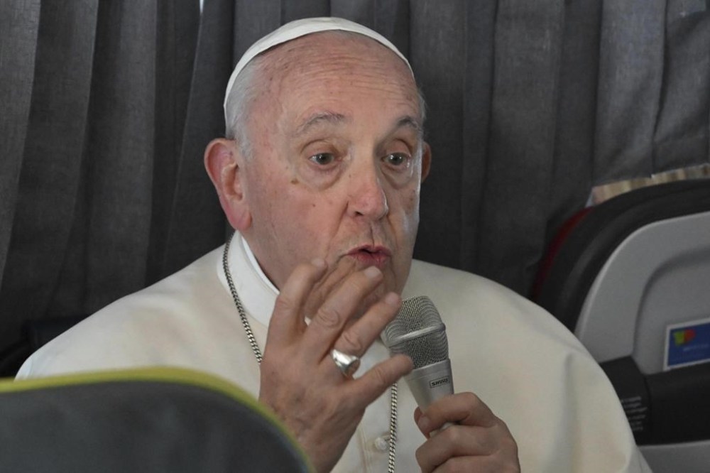Pope Francis meets the journalists during a press conference aboard the airplane directed to Rome, at the end of the 37th World Youth Day in Lisbon, Sunday, Aug. 6, 2023. (Maurizio Brambatti/Pool Photo Via AP)