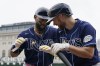 Tampa Bay Rays designated hitter Yandy Diaz, left, greets Brandon Lowe after a two-run home run during the second inning of a baseball game against the Detroit Tigers, Sunday, Aug. 6, 2023, in Detroit. (AP Photo/Carlos Osorio)