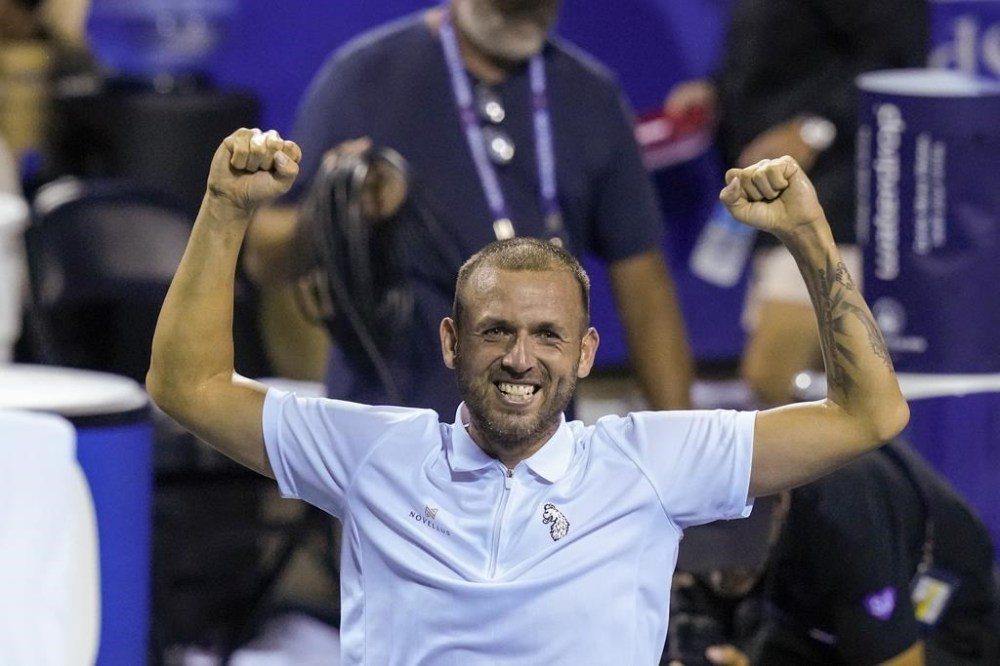 Daniel Evans, of Britain, celebrates after defeating Tallon Griekspoor, of the Netherlands, in the men's singles final of the DC Open tennis tournament Sunday, Aug. 6, 2023, in Washington. (AP Photo/Alex Brandon)