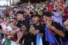 Fans cheers as Inter Miami walks onto the field for warmups before a Leagues Cup soccer match against FC Dallas, Sunday, Aug. 6, 2023, in Frisco, Texas. (AP Photo/LM Otero)