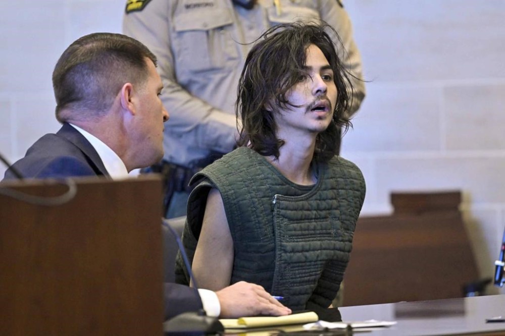FILE - Carlos Dominguez appears in Yolo Superior Court in Woodland, Calif. on June 20, 2023, with a court-appointed public defender Dan Hutchinson. The criminal case against an accused serial stabber is on hold Monday, Aug. 7, 2023, after Northern California prosecutors agreed that the former university student is incompetent to stand trial. Carlos Dominguez faces murder charges in connection to attacks that killed two and terrorized a peaceful college town. (Hector Amezcua/The Sacramento Bee via AP, Pool, File)