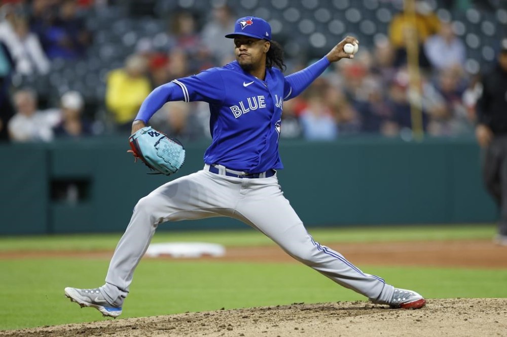 Toronto Blue Jays relief pitcher Genesis Cabrera delivers against the Cleveland Guardians during the sixth inning of a baseball game, Monday, Aug. 7, 2023, in Cleveland. (AP Photo/Ron Schwane)