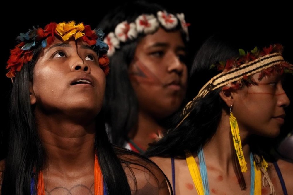 Tembe Indigenous youths perform a ritual dance at the start of a ceremony presenting Brazil's national Indigenous census at Theater da Paz for a in Belem, Brazil, Monday, Aug. 7, 2023. Belem will host the Amazon Summit, a meeting by the nations that are part of the Amazon Cooperation Treaty: Brazil, Bolivia, Colombia, Guyana, Ecuador, Peru, Suriname, Venezuela and French Guiana. (AP Photo/Eraldo Peres)
