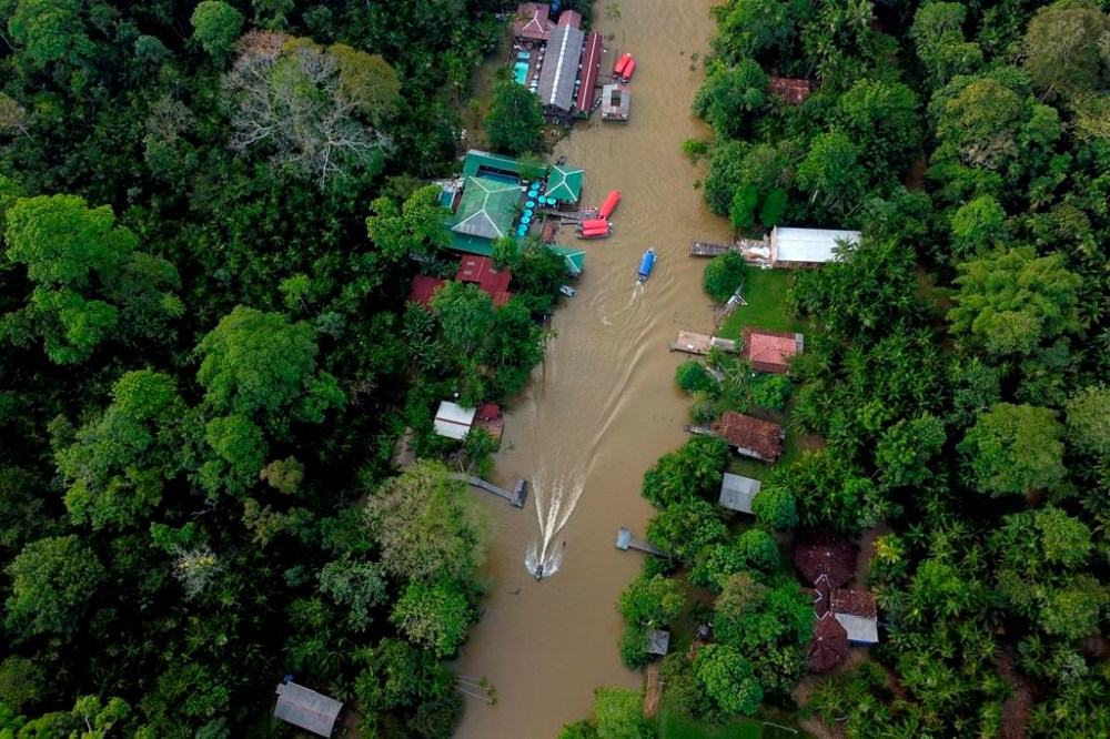 An aerial view of the restaurants on Combu island, on the banks of the Guama River, near Belem, Para state, Brazil, Sunday, Aug. 6, 2023. Belem will play host to the Amazon Summit - IV Meeting of the Presidents of the States party to the Amazon Cooperation Treaty, with the participation of Brazil, Bolivia, Colombia, Guyana, French Guiana, Ecuador, Peru, Suriname and Venezuela. (AP Photo/Eraldo Peres)
