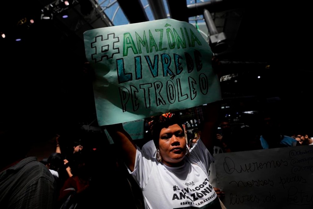 ADDS FRENCH GUIANA - An activist shows a sign that reads in Portuguese