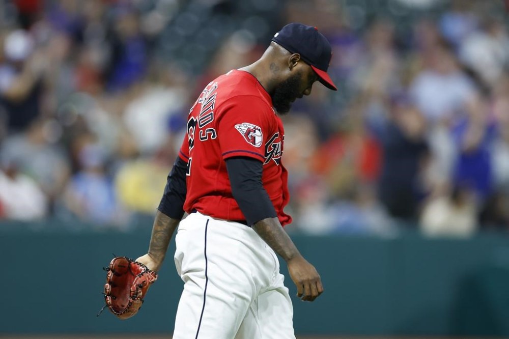 Cleveland Guardians relief pitcher Enyel De Los Santos reacts after giving up a two-run home run to Toronto Blue Jays' Cavan Biggio during the eighth inning of a baseball game, Monday, Aug. 7, 2023, in Cleveland. (AP Photo/Ron Schwane)