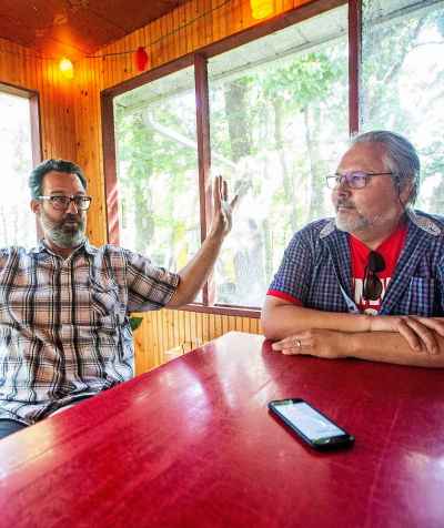 MIKAELA MACKENZIE / WINNIPEG FREE PRESS

Kerry Seabrook (left) and Art Zuke chat with the Free Press in the cabin front porch in Sandy Hook on Monday, July 3, 2023. For Jen story.
Winnipeg Free Press 2023.