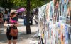 JESSICA LEE / WINNIPEG FREE PRESS
Marianne Morash looks at show listings at the Winnipeg Fringe Festival.