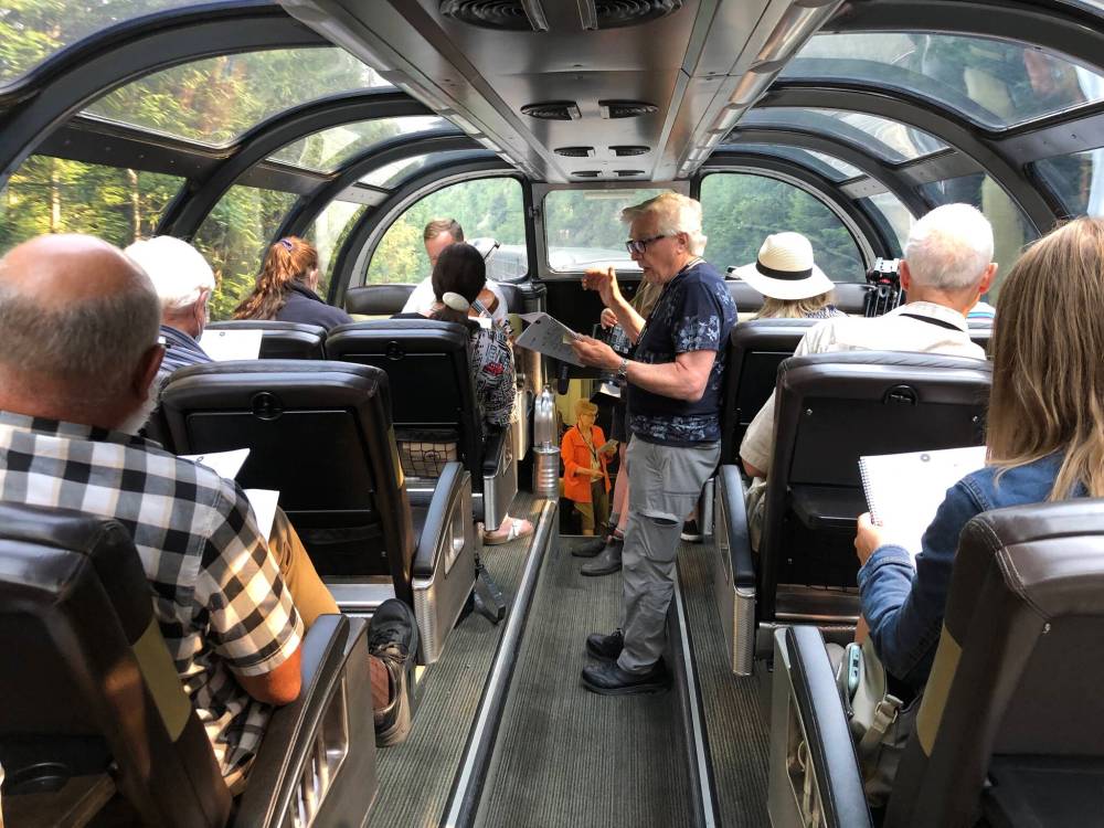 JOHN LONGHURST / WINNIPEG FREE PRESS </p>Retired Winnipeg choral conductor Henry Engbrecht leads the singing in the dome car of The Canadian.