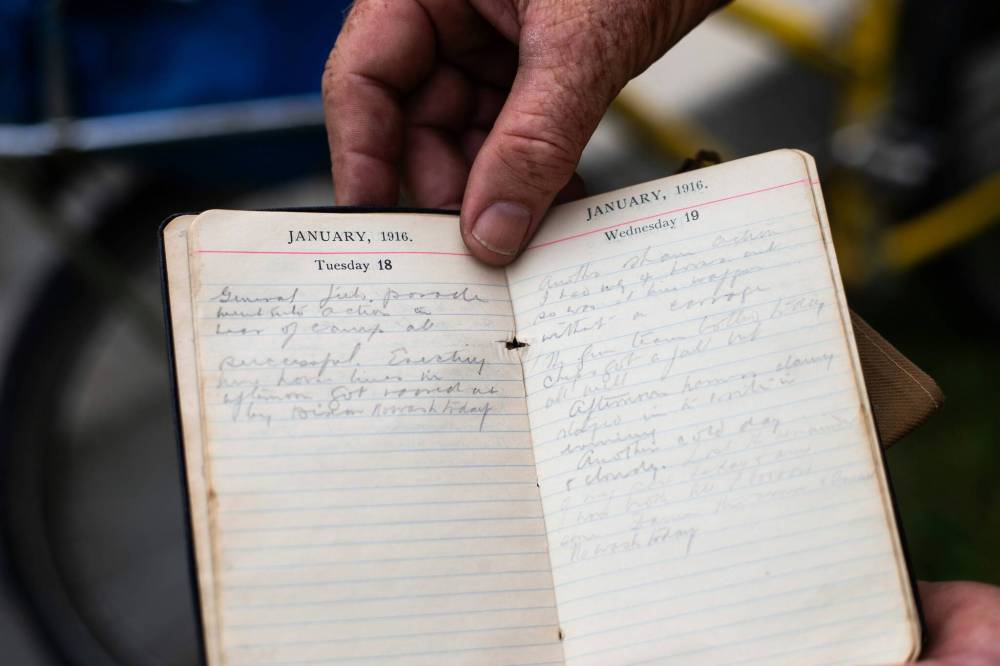 MIKAELA MACKENZIE / WINNIPEG FREE PRESS
Mic Whitty shows his grandfather’s diary which inspired the trip to visit every cemetery where a Commonwealth World War One or Two casualty is buried.