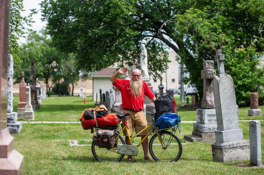 MIKAELA MACKENZIE / WINNIPEG FREE PRESS
Mic Whitty pictured at the St. Boniface Cathedral cemetery on the cross-Canada leg of his journey on Tuesday.