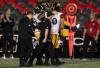 ADRIAN WYLD / THE CANADIAN PRESS
                                Tiger-Cats QB Bo Levi Mitchell is carried off the field Friday following a play in the final seconds of the Hamilton Tiger-Cats’ win over the Ottawa Redblacks.