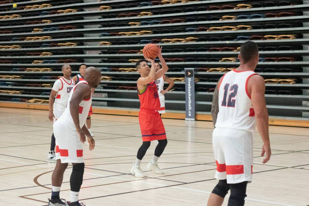 Mike Thiessen / Winnipeg Free Press
A member of the Hong Kong police force eyes a foul shot in a WPFG basketball game against U.S. Customs and Border Patrol officers.