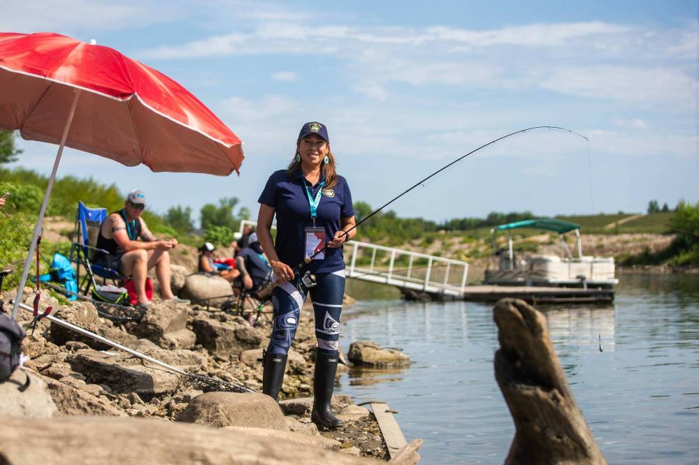 MIKAELA MACKENZIE / WINNIPEG FREE PRESS
                                Tara Singleton competes the shore-angling event Wednesday at the World Police and Fire Games along the Red River in Lockport.