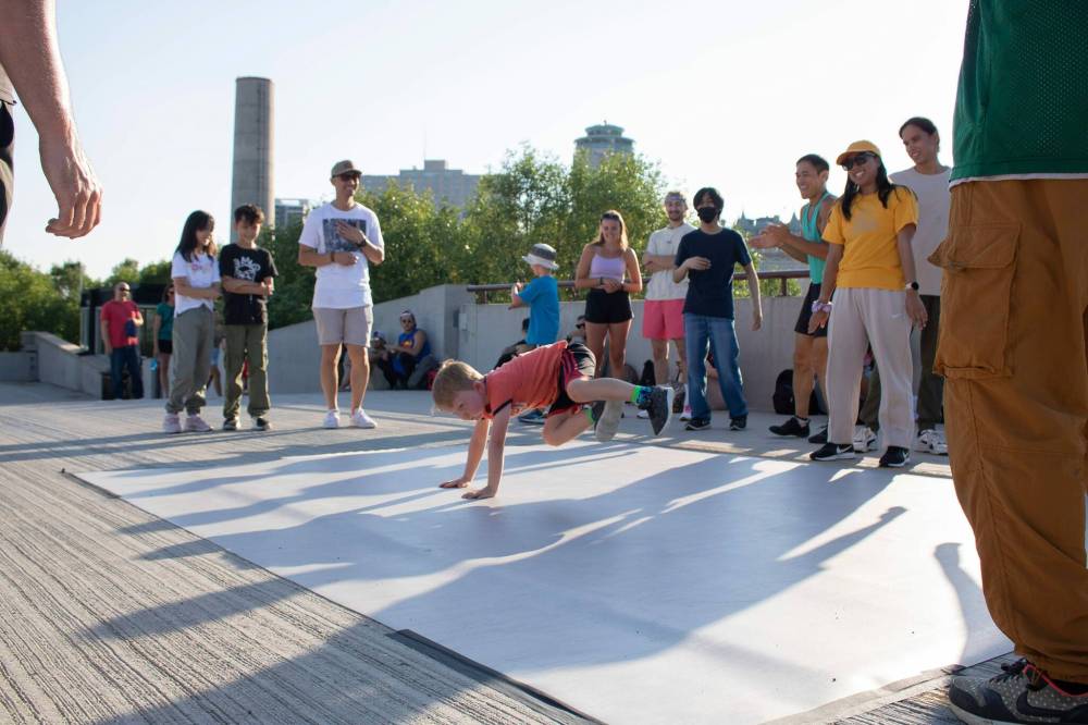 MIKE THIESSEN / WINNIPEG FREE PRESS
Elijah Tallman (centre) is one of many dancers who showed up for the outdoor dance session at the Forks on Wednesday.