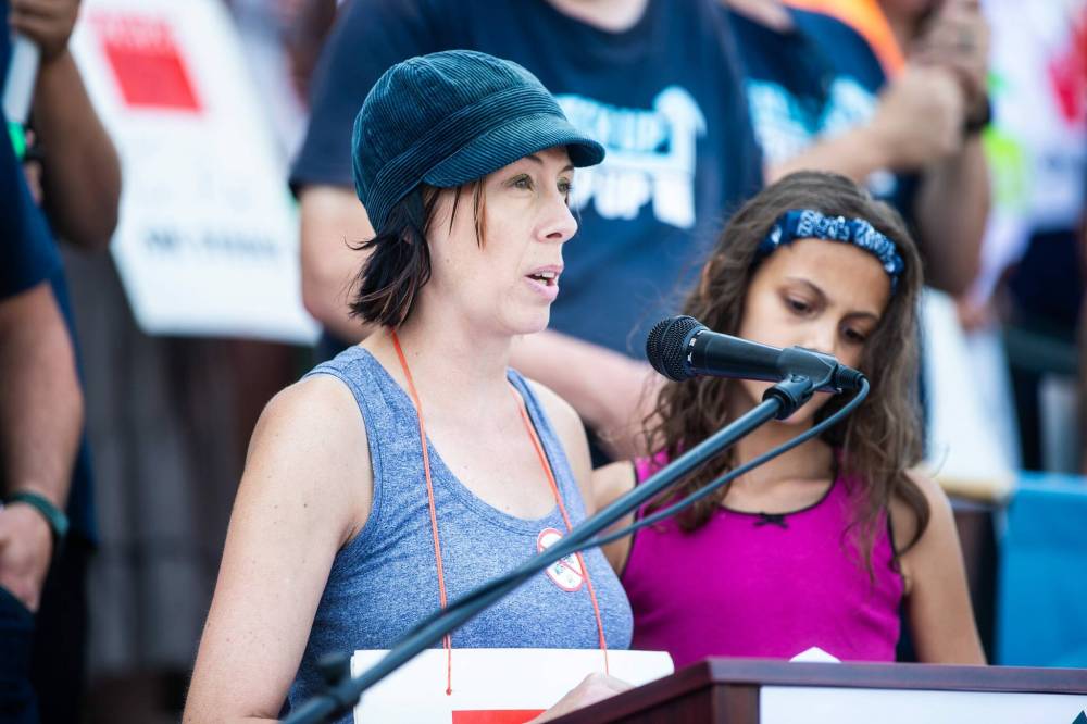 MIKAELA MACKENZIE / WINNIPEG FREE PRESS
Autumn Hartle, a 15-year Liquor Mart worker in Winnipeg, took to the podium to explain how what started as a well-paying job has taken a “nosedive” in wages and working conditions over the past several years.