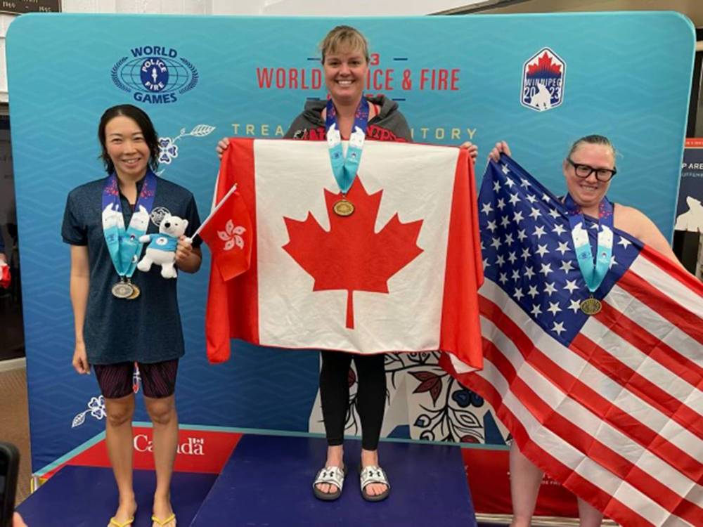 SUPPLIED
                                Winnipeg Fire Paramedic Service Captain Cindy Ceaser tops the podium after taking gold in the women’s 100-metre freestyle race at the World Police and Fire Games.