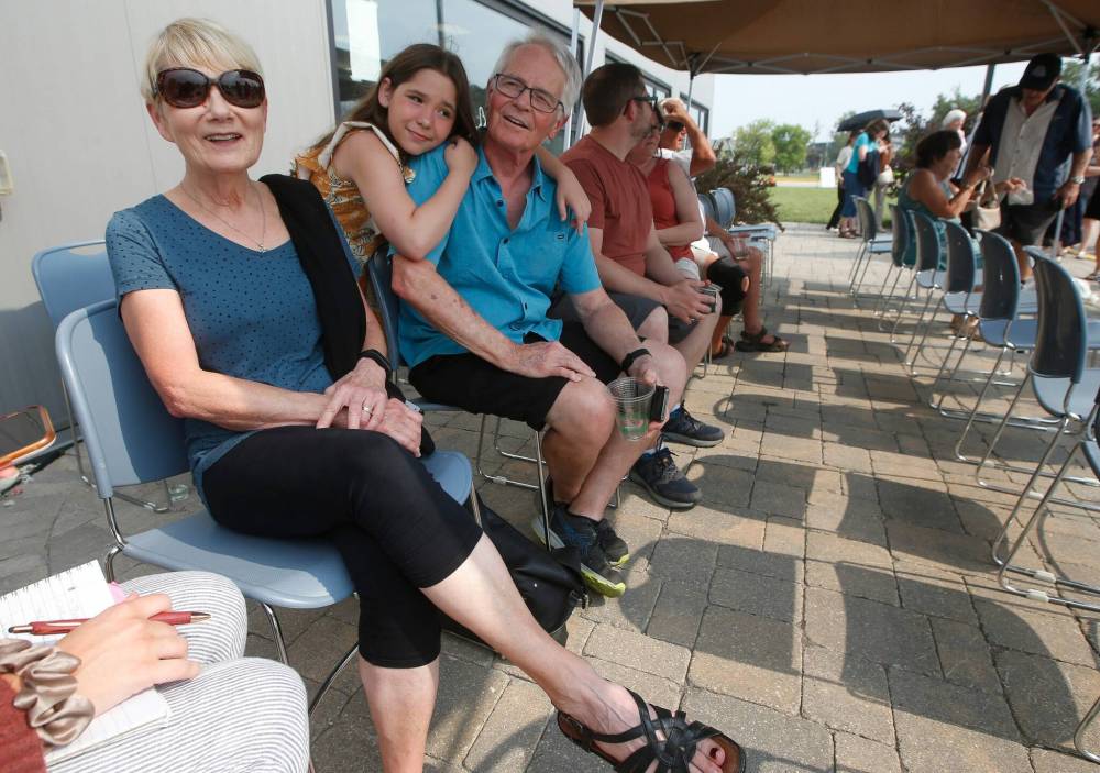 JOHN WOODS / WINNIPEG FREE PRESS
Jo and Larry Verstraete and their granddaughter, Reaghan, were first in line to get into the Ukraine pavilion in Winnipeg, Monday. They say the show lets them connect with their heritage.