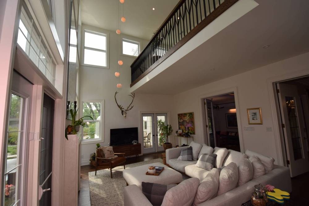 Breathtaking yet functional, the family room is a study in volume, light and fashion.