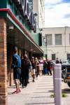 MIKAELA MACKENZIE / WINNIPEG FREE PRESS
                                Customers lineup at the Liquor Mart at Ellice and Hargrave (one of the few left open in the city during an employee strike) at opening time.