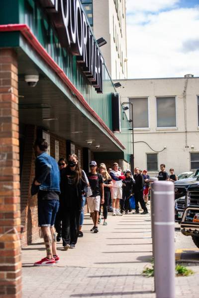 MIKAELA MACKENZIE / WINNIPEG FREE PRESS
                                Customers lineup at the Liquor Mart at Ellice and Hargrave (one of the few left open in the city during an employee strike) at opening time.