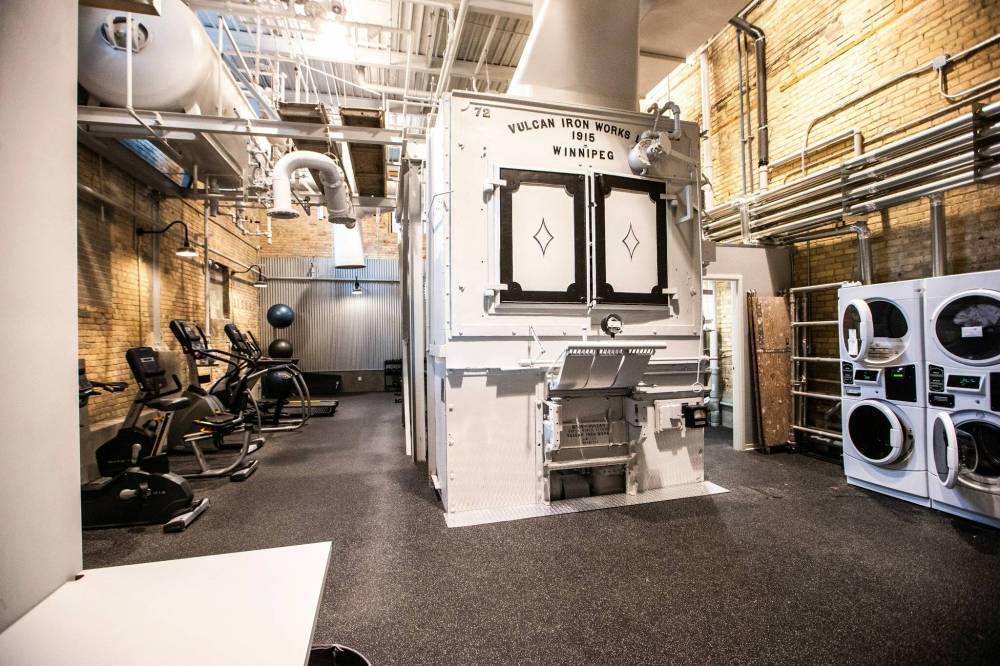 MIKAELA MACKENZIE / WINNIPEG FREE PRESS
                                An exercise and laundry area after the redevelopment of the 100,000-square-foot historic building by brothers Mark and Rick Hofer of MRH Properties