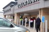 TYLER SEARLE / WINNIPEG FREE PRESS
                                A line of nearly 100 people gathered outside the St. Vital Square Liquor Mart at 827 Dakota St. Saturday.