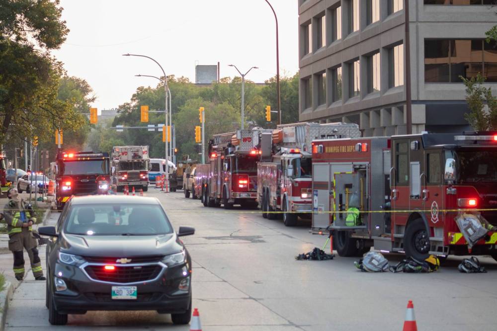 MIKE THIESSEN / WINNIPEG FREE PRESS
Fire crews responded to a two-alarm call for “heavy fire” on the roof of 221 Stradbrook Ave., known as The Spot at East Village.