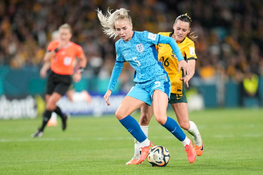 ALESSANDRA TARANTINO / THE ASSOCIATED PRESS
Australia’s Hayley Raso, right, challenges for the ball with England’s Alex Greenwood during the Women’s World Cup semifinal soccer match between Australia and England at Stadium Australia in Sydney, Australia, Wednesday, Aug. 16, 2023.