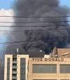 SUPPLIED PHOTO
                                Black smoke rises from the fire at the 18-storey building at 221 Stradbrook Ave., known as The Spot at East Village.