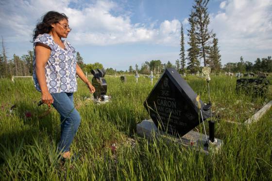 Vivian Caron visits the grave of her son, Evan Caron, in the Gypsumville cemetery. Evan was shot and killed by police in Winnipeg in 2017. (Daniel Crump / Winnipeg Free Press files)