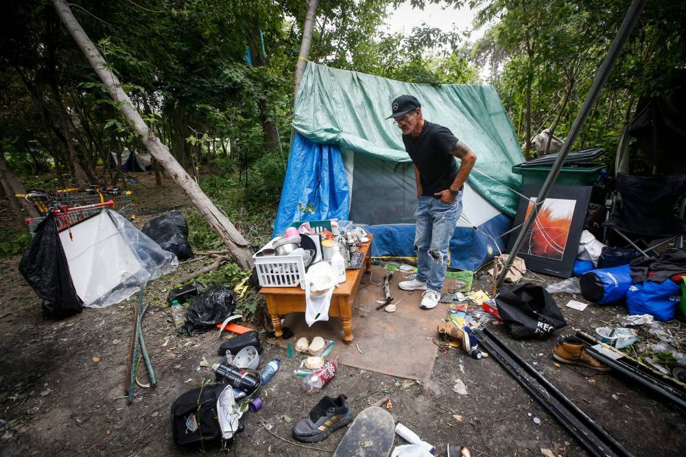 JOHN WOODS / WINNIPEG FREE PRESS
Terry Johnsen, who was evicted from the Adanac Apartments on Sargent Ave., has set up camp on the Assiniboine River bank in Winnipeg Tuesday.