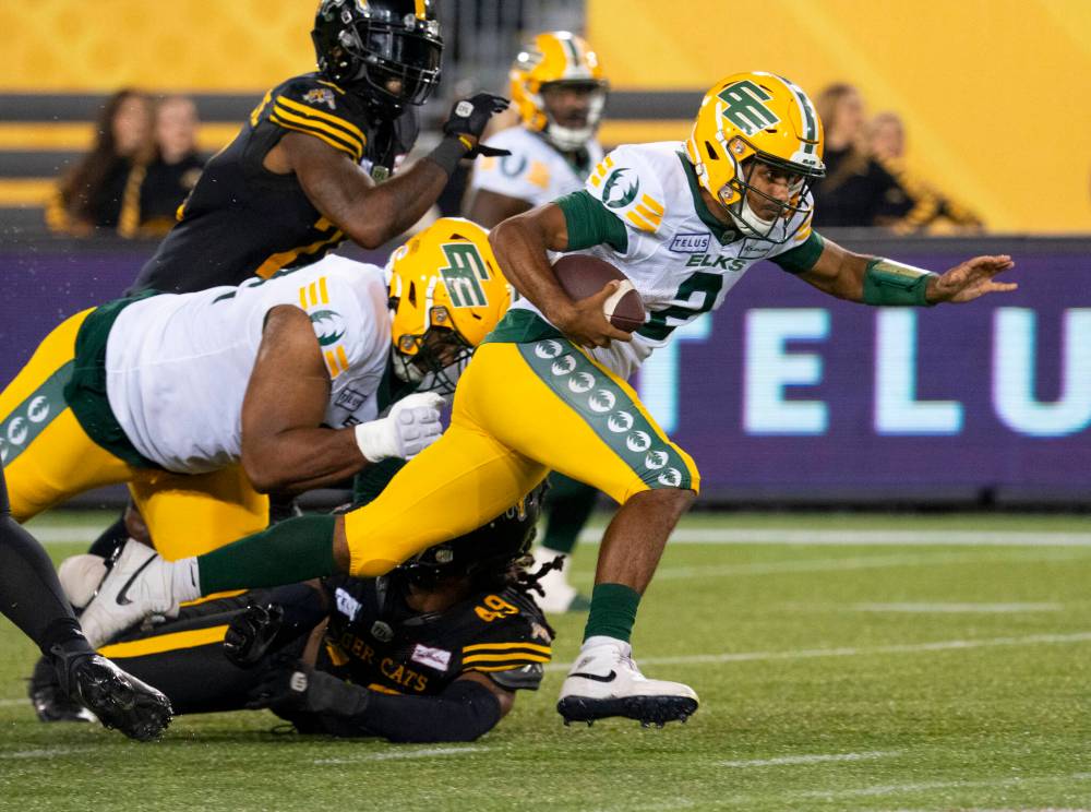 PETER POWER / THE CANADIAN PRESS
Edmonton QB Tre Ford’s success in leading he Elks to victory raised the question: what took so long for the Canadian QB to be given the chance to start.