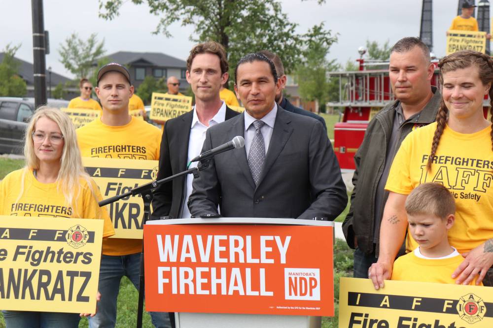 Tyler Searle / Winnipeg Free Press
Manitoba NDP leader Wab Kinew announced the funding alongside NDP Waverley candidate David Pankratz (left), United Fire Fighters of Winnipeg president Tom Bilous (right) and an assortment of union members Thursday.
