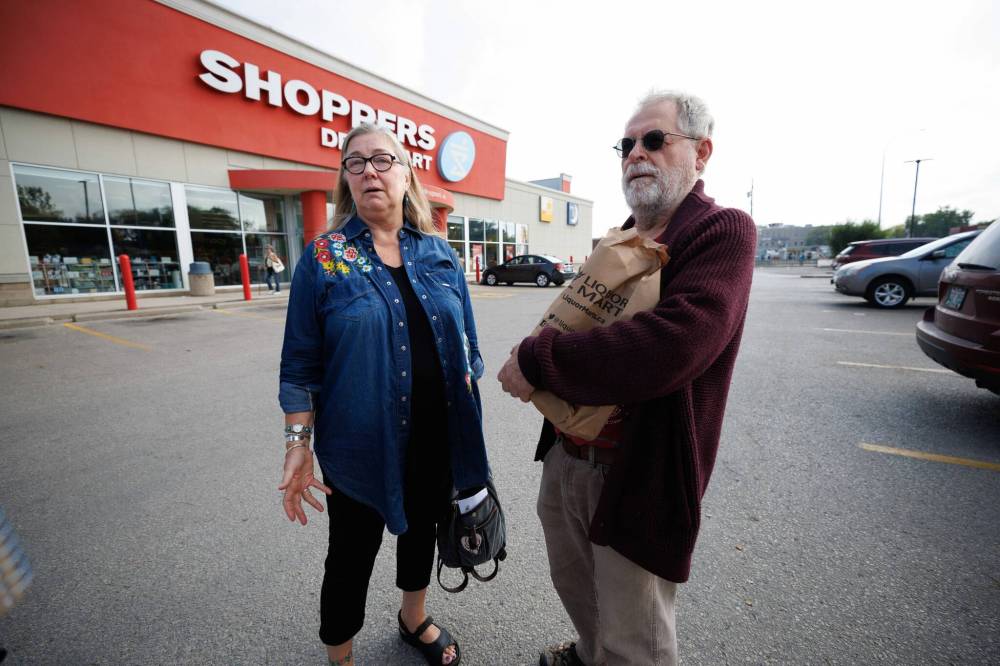 MIKE DEAL / WINNIPEG FREE PRESS
Friends Lois Kunkel (left) and Bob Haverluck stop in at the Liquor Mart at Portage and Burnell Monday morning.