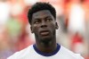 FILE - United States midfielder Yunus Musah stands for the national anthems prior to their friendly soccer match against Morocco, Wednesday, June 1, 2022, in Cincinnati. Musah is following United States teammate Christian Pulisic to American-owned AC Milan. Musah, who was born in New York but grew up in Italy and England, signed a five-year contract with the Rossoneri on Friday, Aug. 4, 2023 following a transfer from Valencia. (AP Photo/Jeff Dean, file)