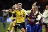 Sweden's Lina Hurtig celebrates with teammates at the end of a penalty shootout during the Women's World Cup round of 16 soccer match between Sweden and the United States in Melbourne, Australia, Sunday, Aug. 6, 2023. (AP Photo/Hamish Blair)
