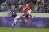 Japan's Takuma Asano, left, and Canada's Alistair Johnston battle for the ball during a friendly soccer match in Dubai on Thursday, Nov. 17, 2022. THE CANADIAN PRESS/AP-Christopher Pike