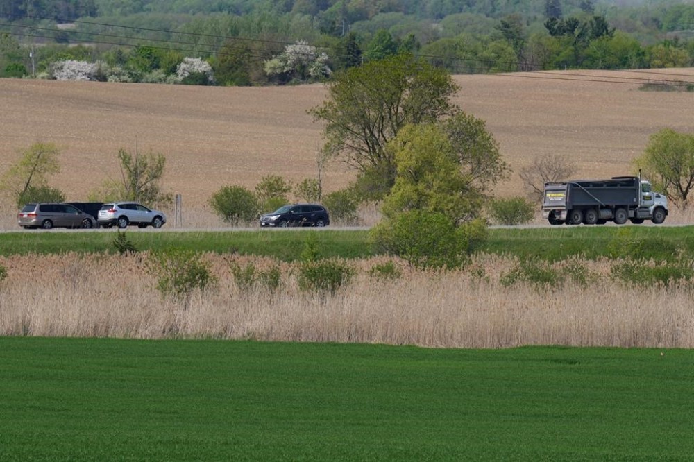 Traffic passes through the Duffins Rouge Agricultural Preserve, part of Ontario's Greenbelt, on Monday, May 15, 2023. Ontario's auditor general is set to release her value-for-money investigation into the province's decision to open protected Greenbelt lands up to housing development. THE CANADIAN PRESS/Chris Young