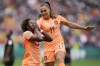 Netherlands' Lineth Beerensteyn (7) celebrates with' Lieke Martens after scoring her side's second goal during the second half of a Women's World Cup round of 16 soccer match between the Netherlands and South Africa at the Sydney Football Stadium in Sydney, Australia, Sunday, Aug. 6, 2023. (AP Photo/Rick Rycroft)