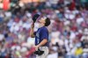 Seattle Mariners starting pitcher Bryan Woo looks up before taking the mound in the first inning of the team's baseball game against the Los Angeles Angels, Thursday, Aug. 3, 2023, in Anaheim, Calif. (AP Photo/Ryan Sun)