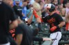 Baltimore Orioles' Ryan Mountcastle is greeted in the dugout after hitting a two-run home run off Houston Astros starting pitcher Framber Valdez in the first inning of a baseball game, Tuesday, Aug. 8, 2023, in Baltimore. Orioles' Adley Rutschman scored on the home run. (AP Photo/Julio Cortez)
