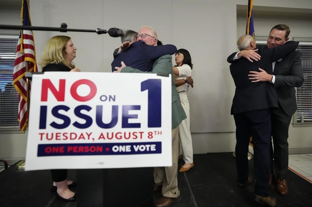 Organizers celebrate the defeat of Issue 1 during an election night party at the Columbus Fire Fighters Local 67 on Tuesday, Aug. 8, 2023 in Columbus, Ohio. Ohio voters have rejected a proposal that would've made it more difficult for voters to amend the state constitution, including one measure set for the November ballot that would guarantee abortion rights in the state. (Adam Cairns/The Columbus Dispatch via AP)