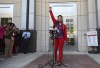 Attorney Monique Worrell of the 9th Judicial Circuit, which serves Orange and Osceola counties, ends her press conference with a raised fist Wednesday, Aug. 9, 2023, outside her former office in the Orange County Courthouse complex in Orlando, Fla. Florida Gov. Ron DeSantis suspended Worrell on Wednesday, again wielding his executive power over local government in taking on a contentious issue in the 2024 presidential race. Worrell vowed to seek reelection next year and said her removal was political and not about her performance. (Ricardo Ramirez Buxeda/Orlando Sentinel via AP)