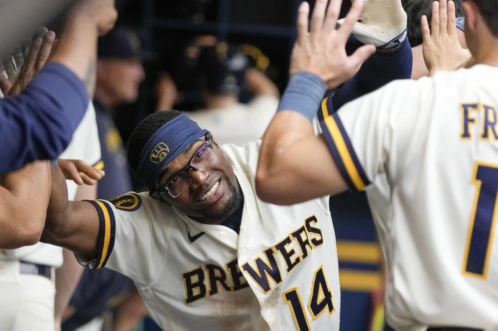 Milwaukee Brewers' Andruw Monasterio celebrates after hitting a home run during the fifth inning of a baseball game against the Colorado Rockies Wednesday, Aug. 9, 2023, in Milwaukee. (AP Photo/Morry Gash)