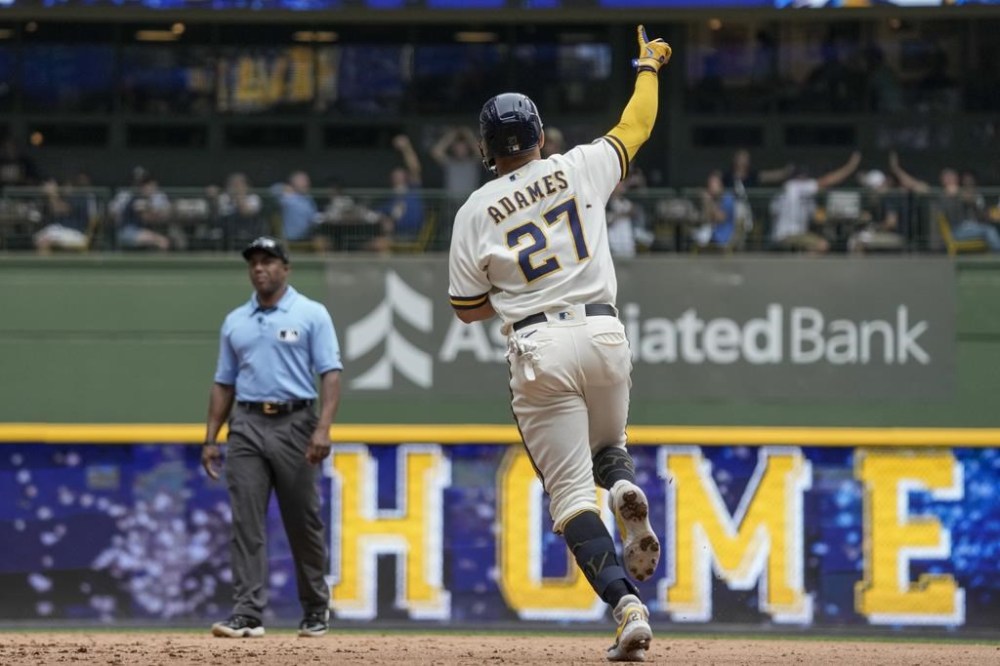 Milwaukee Brewers' Willy Adames celebrates after hitting a home run during the fifth inning of a baseball game against the Colorado Rockies Wednesday, Aug. 9, 2023, in Milwaukee. (AP Photo/Morry Gash)