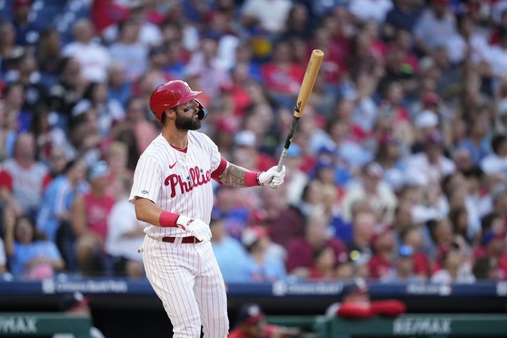 Philadelphia Phillies' Weston Wilson watches after hitting a home run against Washington Nationals pitcher MacKenzie Gore during the second inning of a baseball game, Wednesday, Aug. 9, 2023, in Philadelphia. (AP Photo/Matt Slocum)
